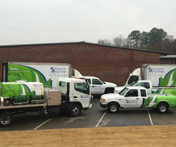 Fleet of lawn legacy lawn care trucks